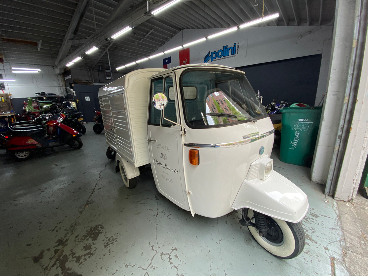 Piaggio Ape and Vespa inside the shop